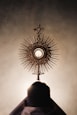 silhouette of person standing near brown round decor