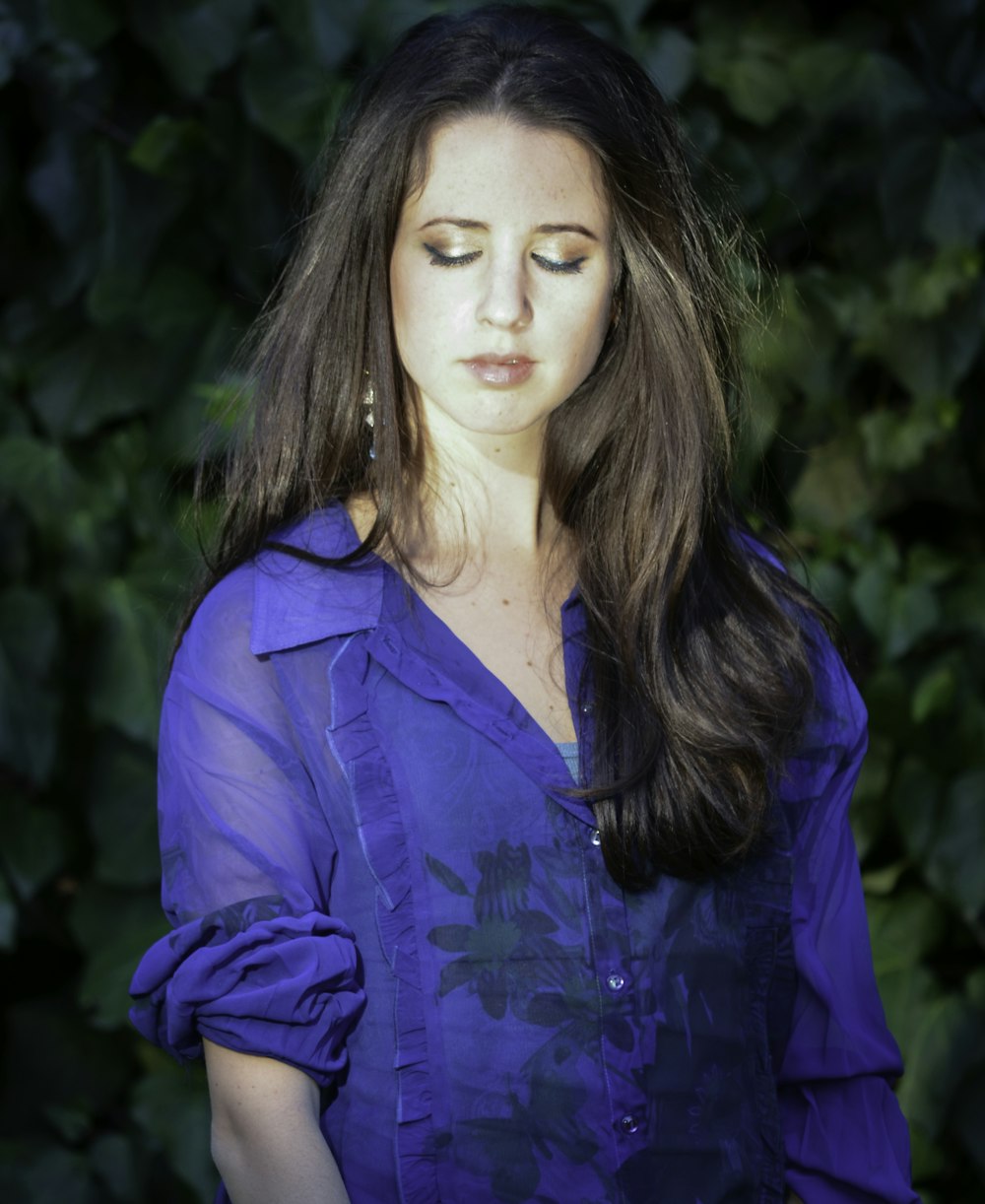 woman in blue button up long sleeve shirt