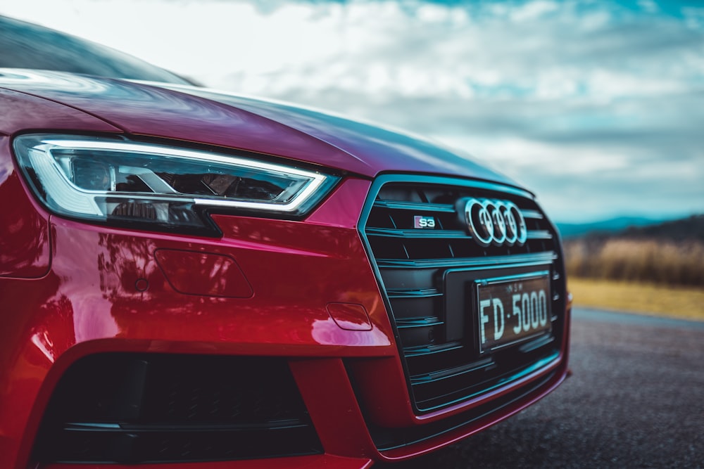 red audi car in close up photography