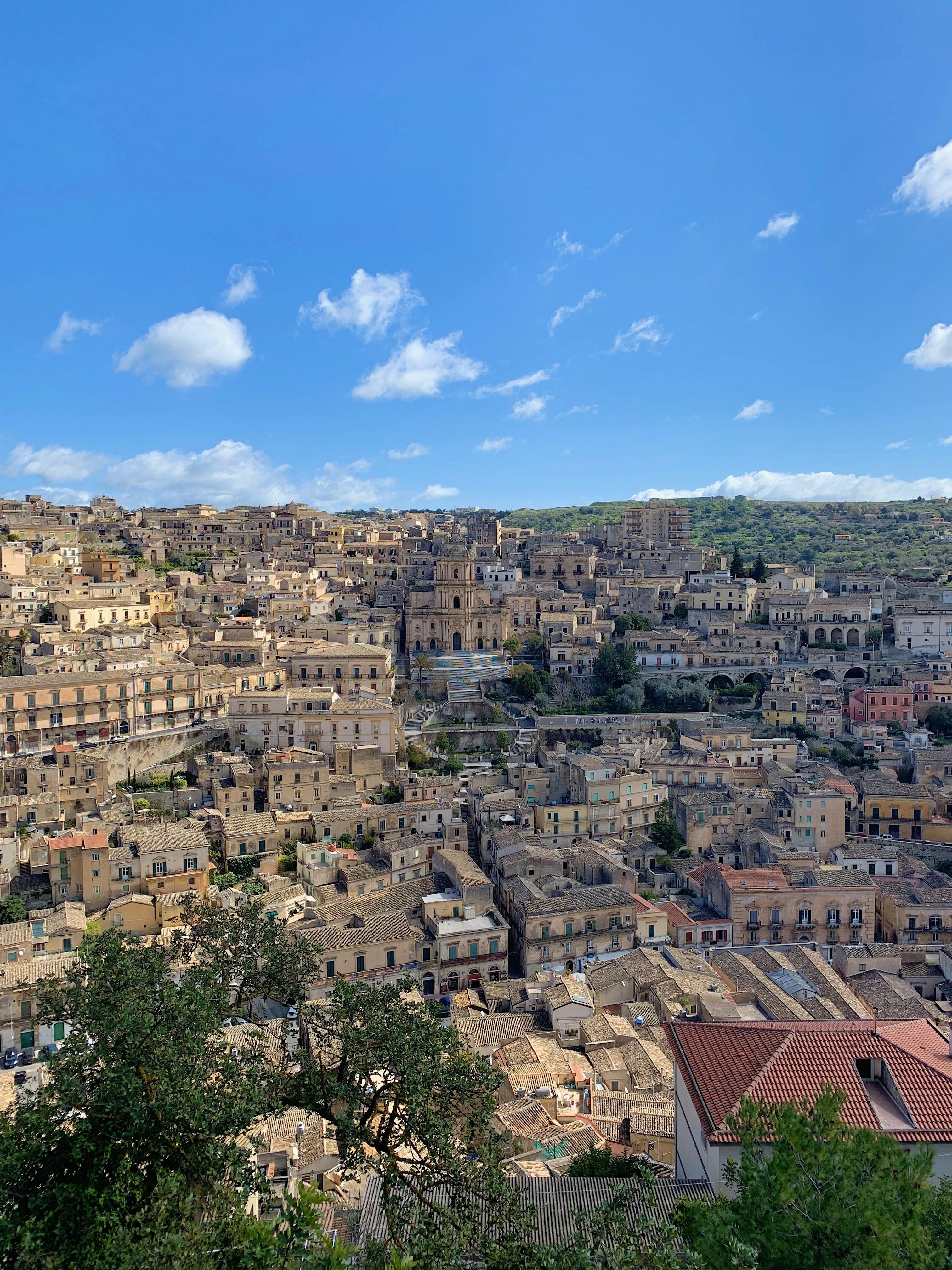 brown and white concrete houses under blue sky during daytime