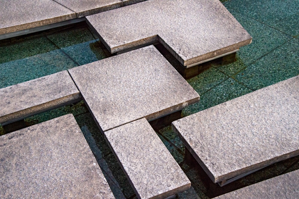 gray concrete blocks on green grass