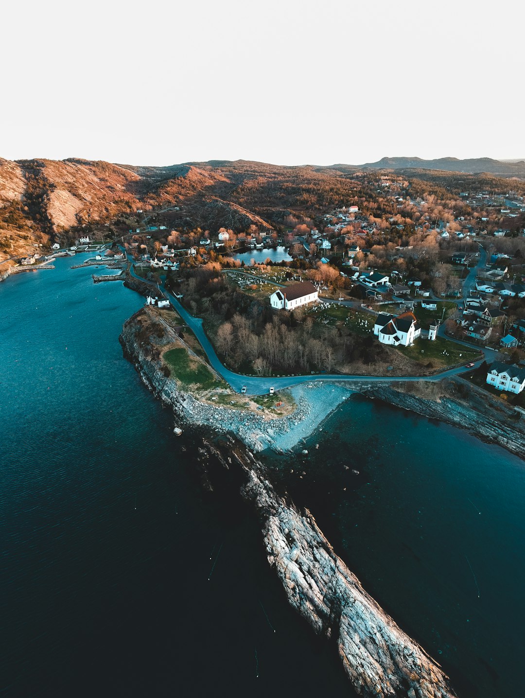 aerial view of city near body of water during daytime