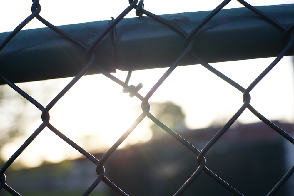 grey metal fence during daytime