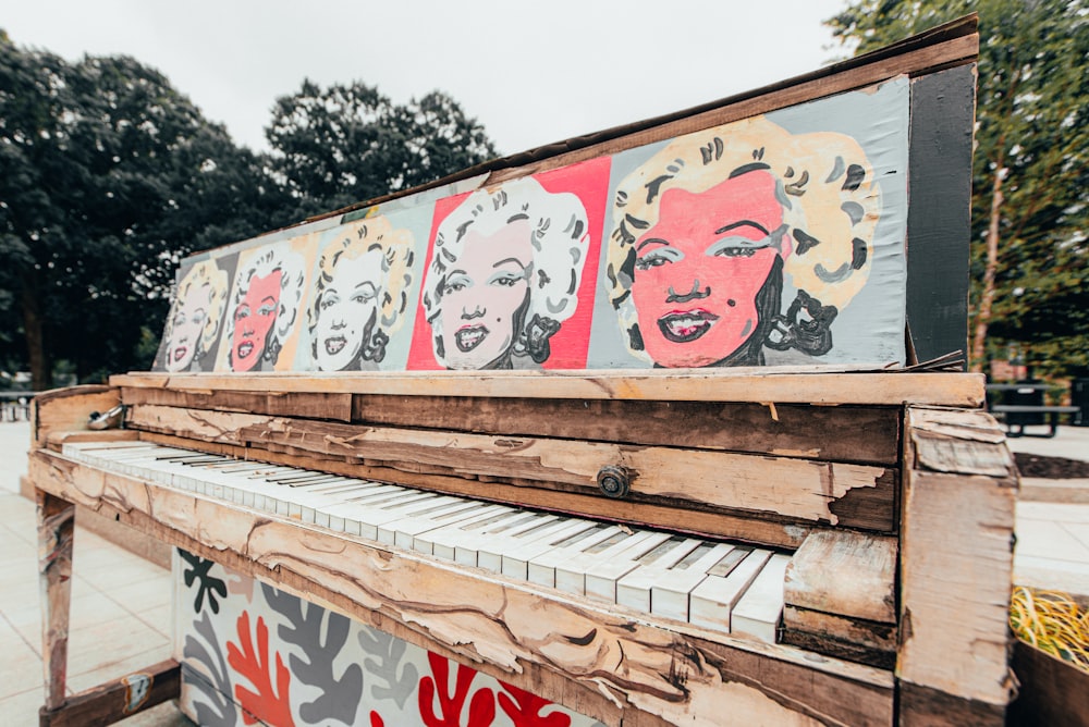 white and red graffiti on brown wooden fence