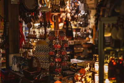 Display of various souvenirs including keychains and small crafts in a cozy shop.
