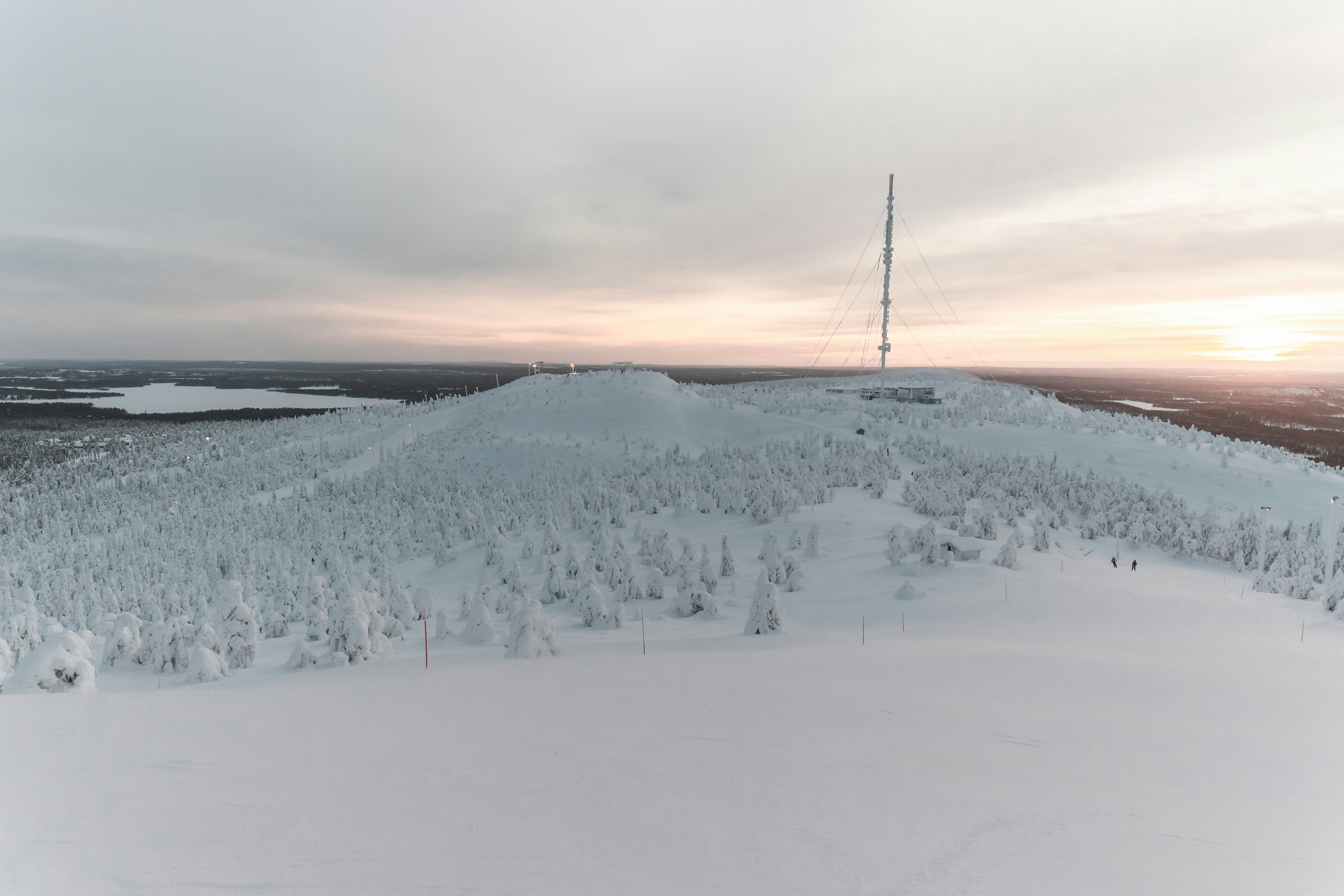 snow covered mountain during sunset