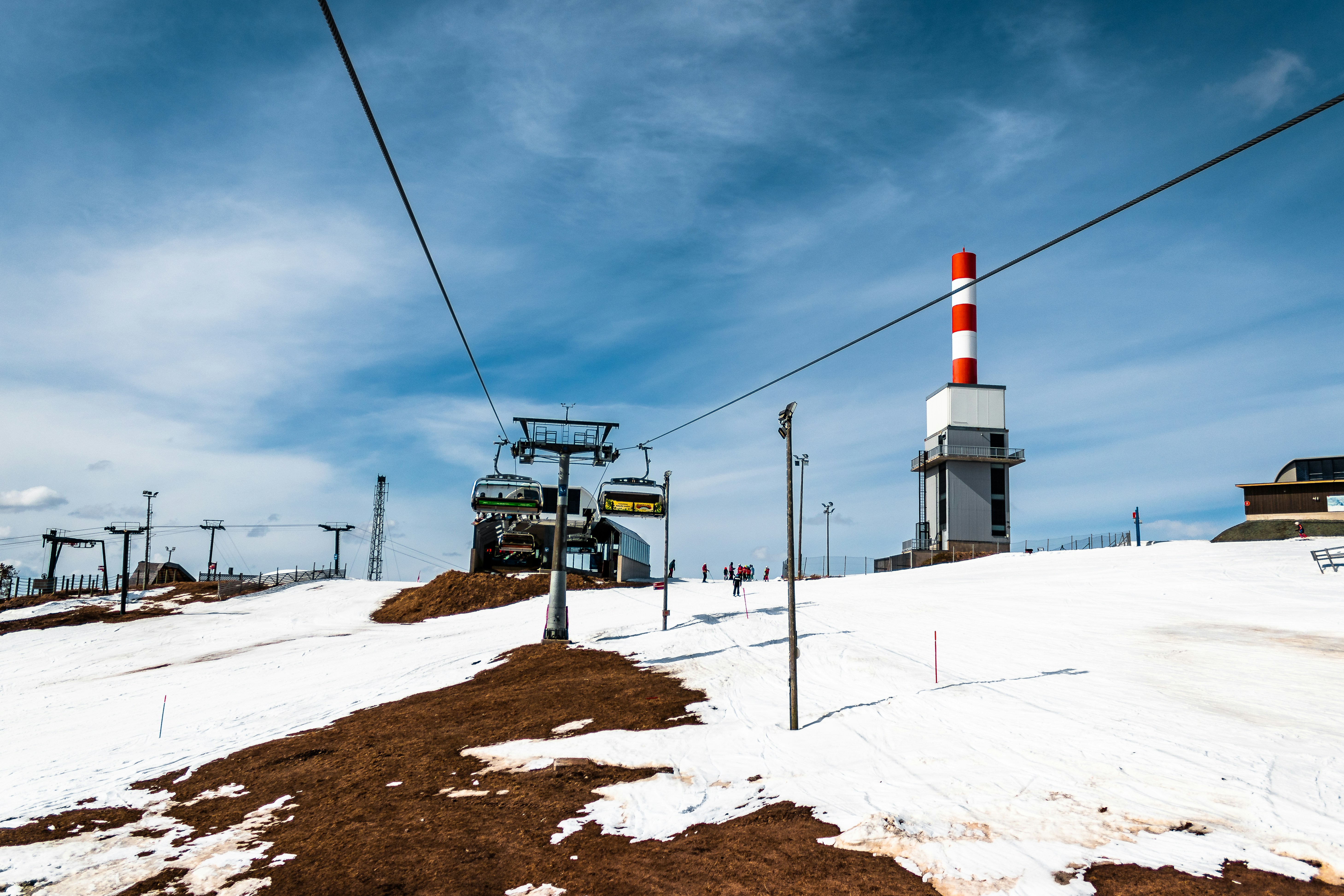 white and red tower on brown soil under white clouds during daytime splendid teams background