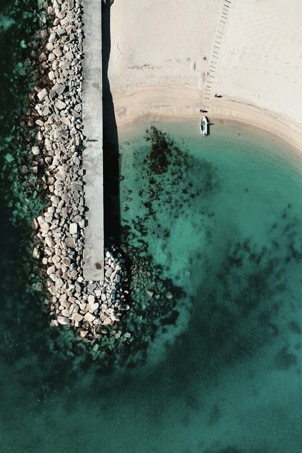 aerial view of people swimming on pool during daytime