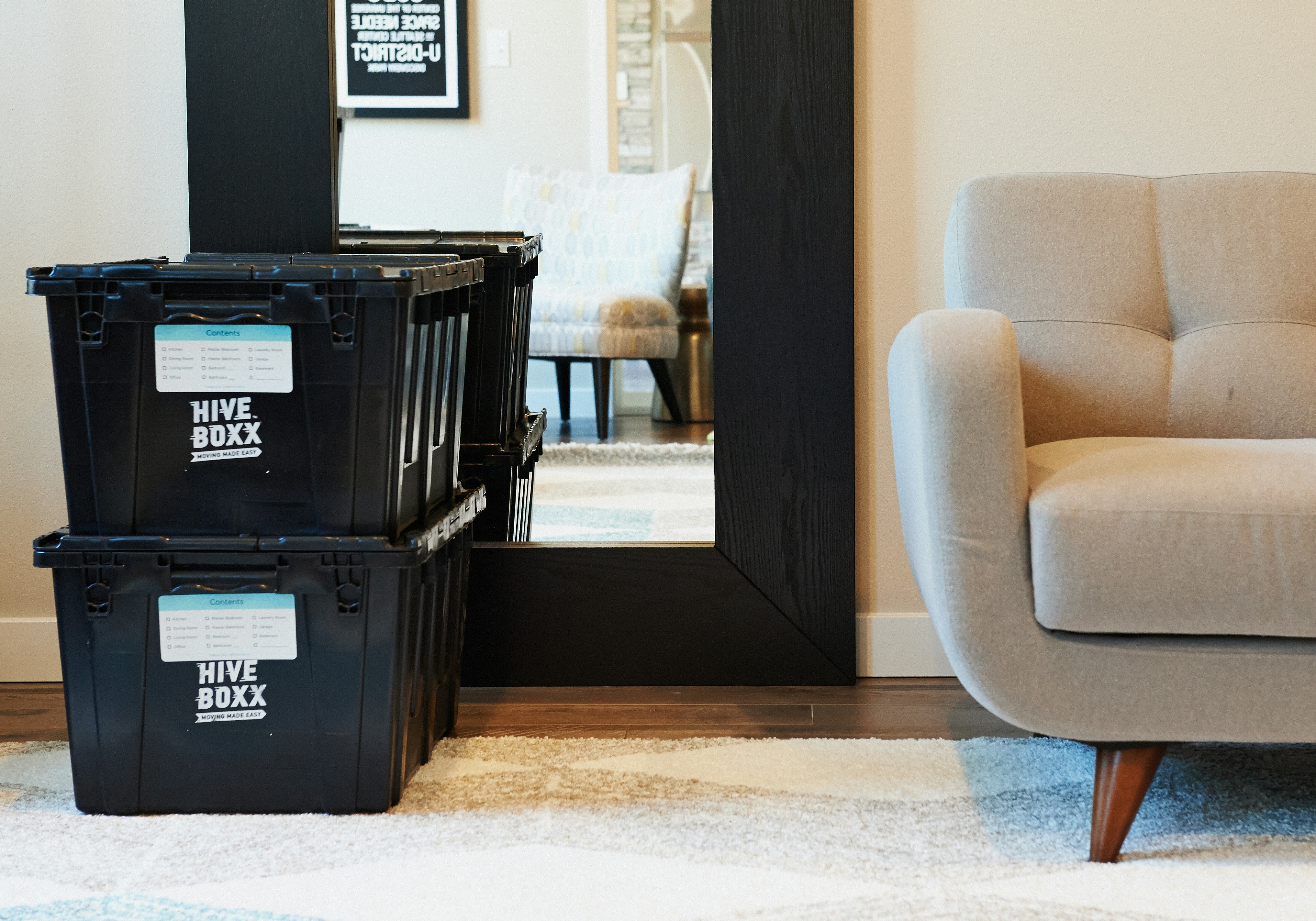 black plastic crate beside brown wooden door