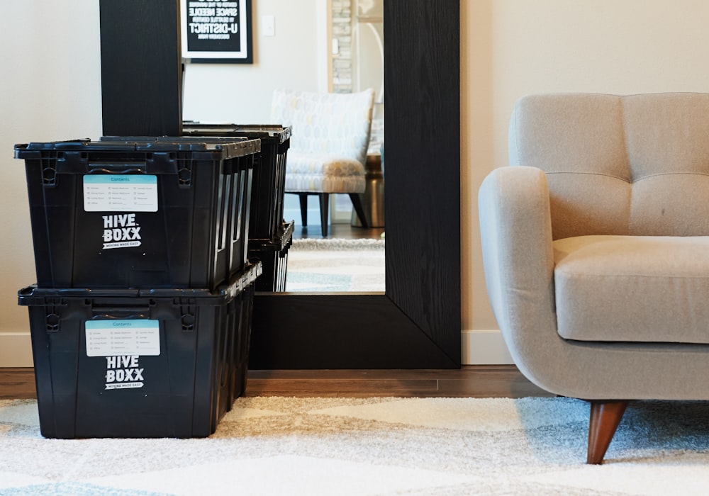 black plastic crate beside brown wooden door