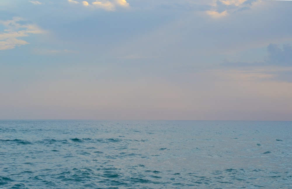 blue sea under blue sky during daytime