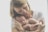 A serene scene of a mother reading a checklist with baby essentials.