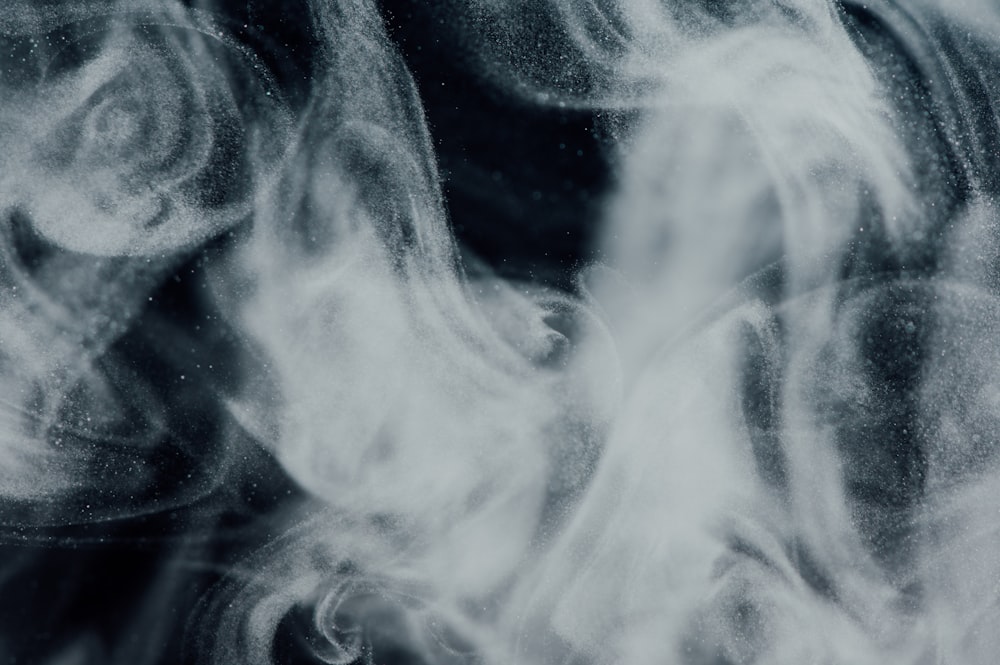 white smoke on black background