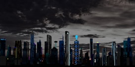 A futuristic cityscape featuring a skyline with a variety of tall, modern skyscrapers under a dramatic, cloud-filled sky. The buildings are illuminated with lights and digital screens, some displaying logos or advertisements. The setting appears to be at dusk or night, giving a vibrant yet somewhat eerie atmosphere.
