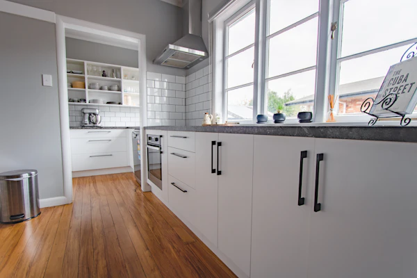 Cabinet Hardware Planning: white wooden kitchen cabinet near window