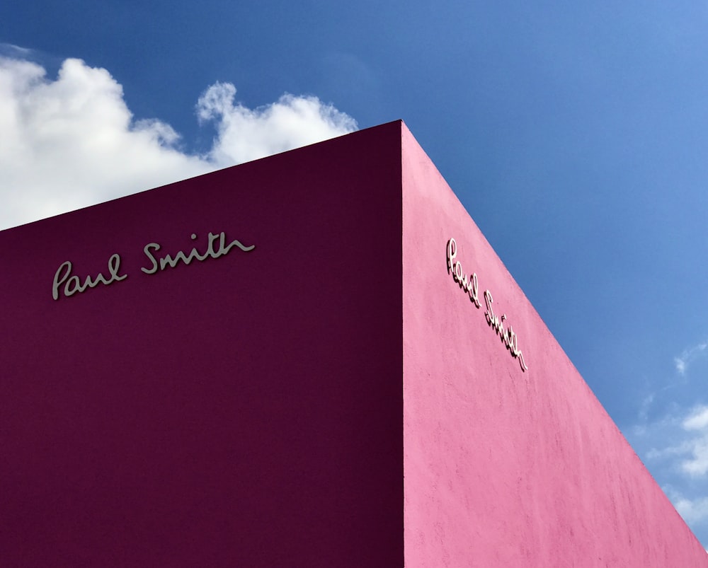 a pink building with the name paul smith on it