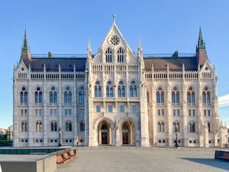 brown and gray concrete building under blue sky during daytime
