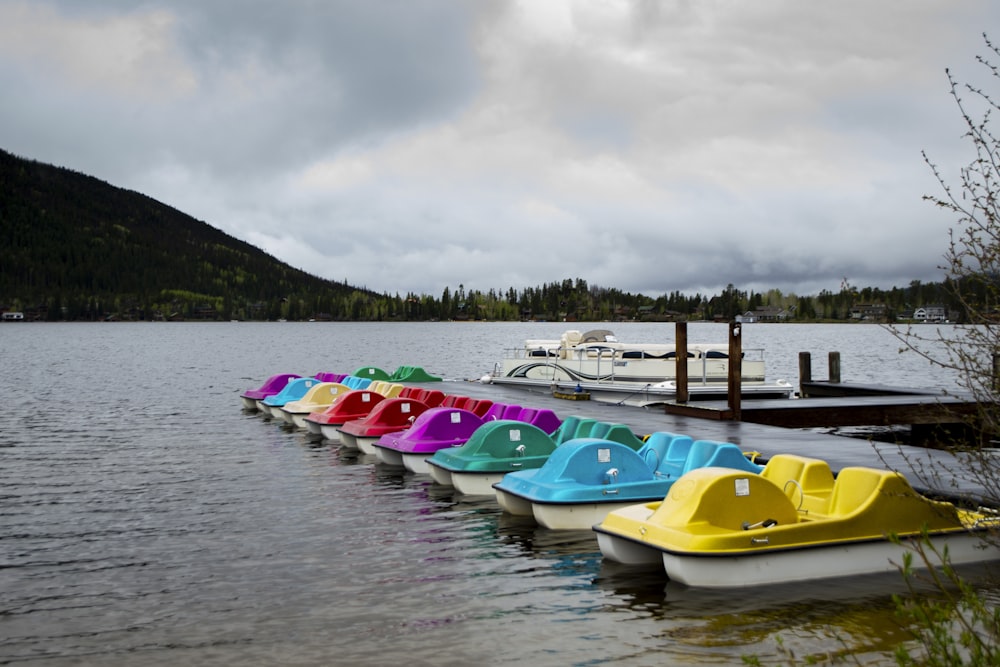 green and white kayak on water