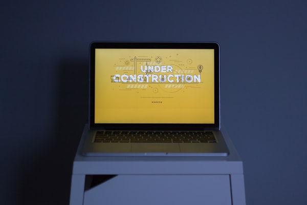 Small shed or fence structure being torn down and removed from a property