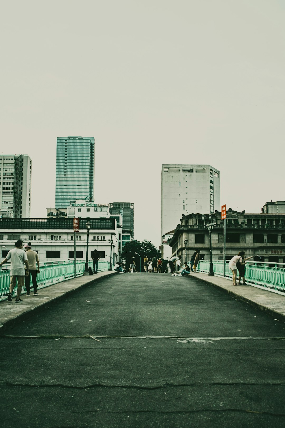 people walking on sidewalk near buildings during daytime