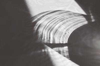 Geometric line art on a textured canvas highlighting subtle color gradients.