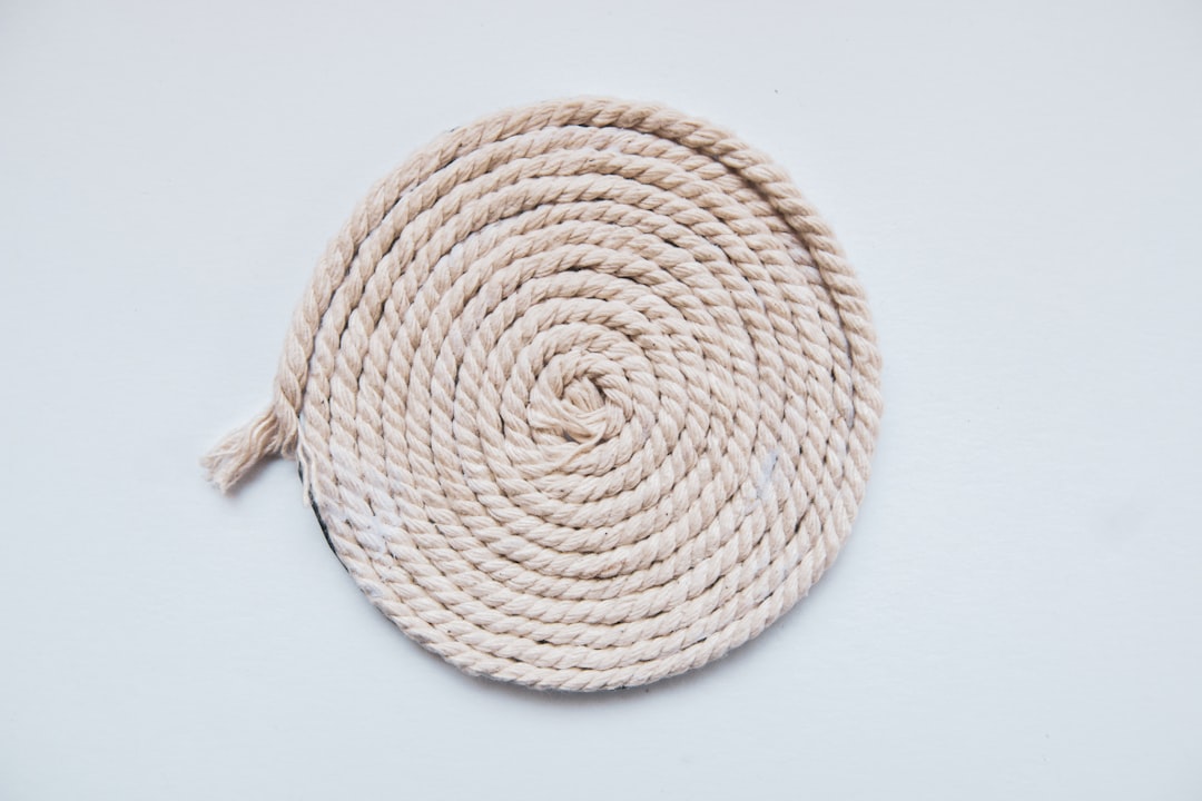  brown rope on white surface rope