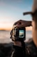 person holding black dslr camera