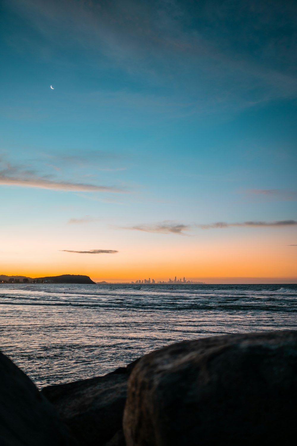 body of water during sunset