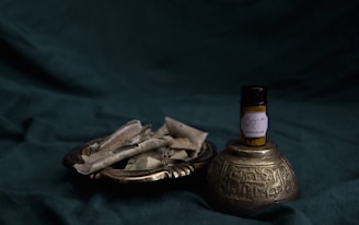 gold and black bottle on gold round tray