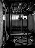 exercise equipments in grayscale photography