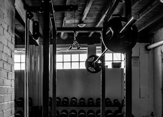 exercise equipments in grayscale photography