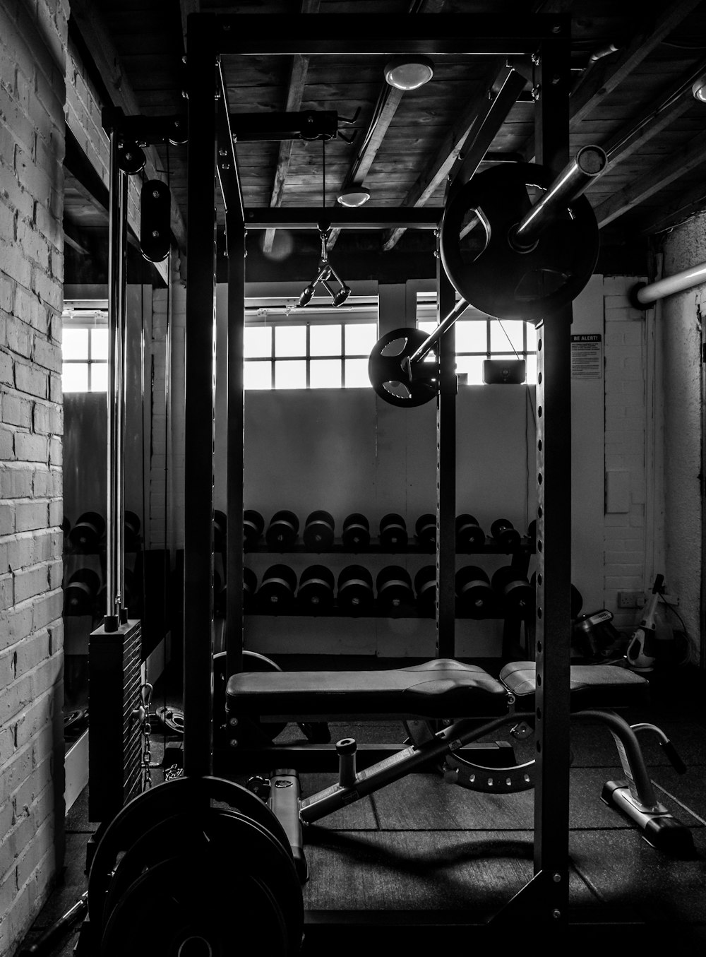 exercise equipments in grayscale photography