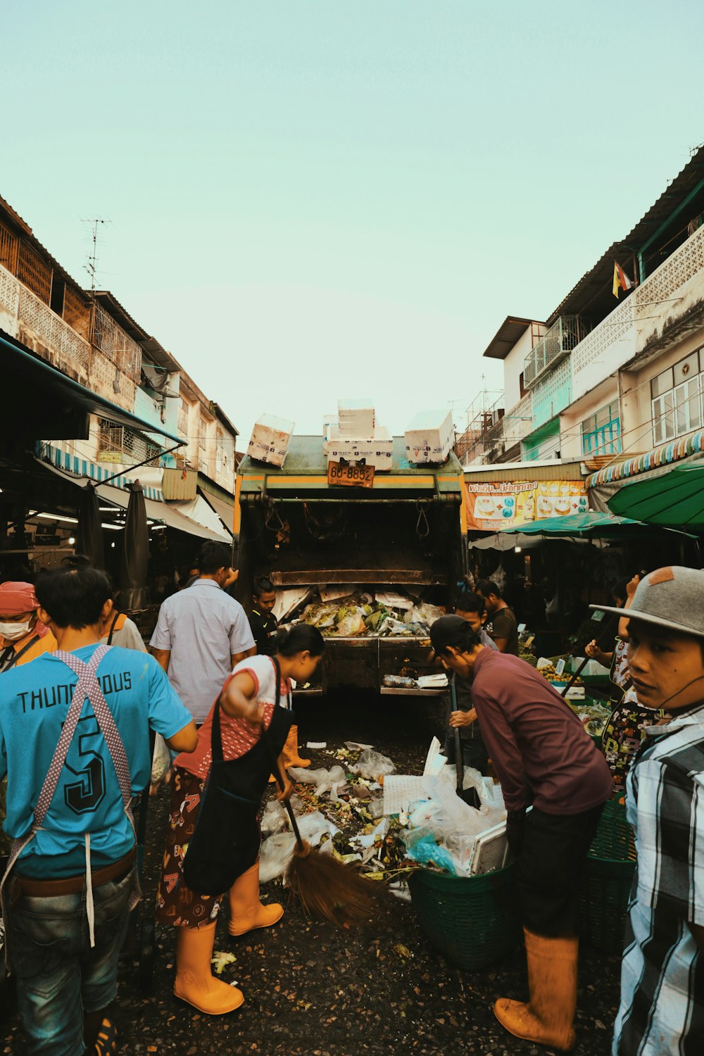 people standing in front of food stall during daytime