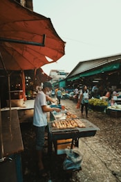 people standing in front of food stall during daytime