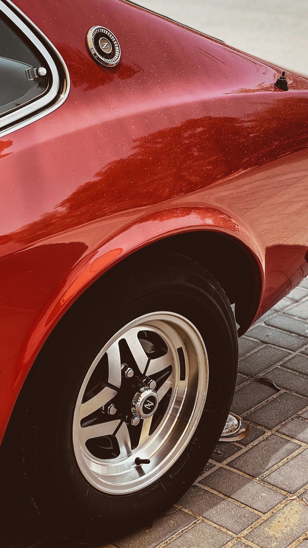 red car with chrome wheel