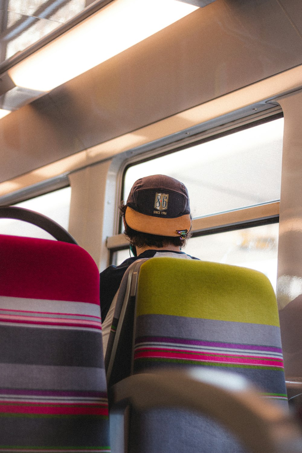 man in yellow and black cap and yellow jacket