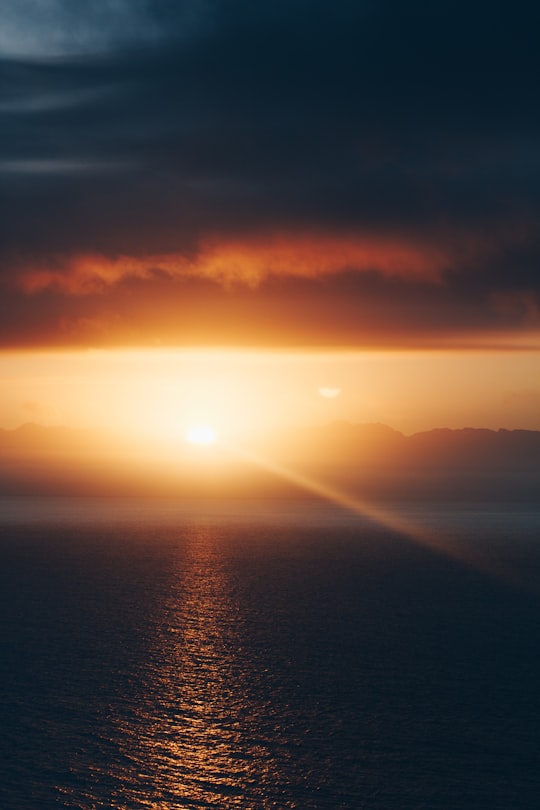 body of water under cloudy sky during sunset in False Bay South Africa