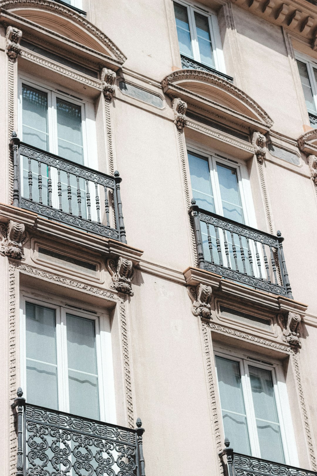 brown concrete building with glass windows