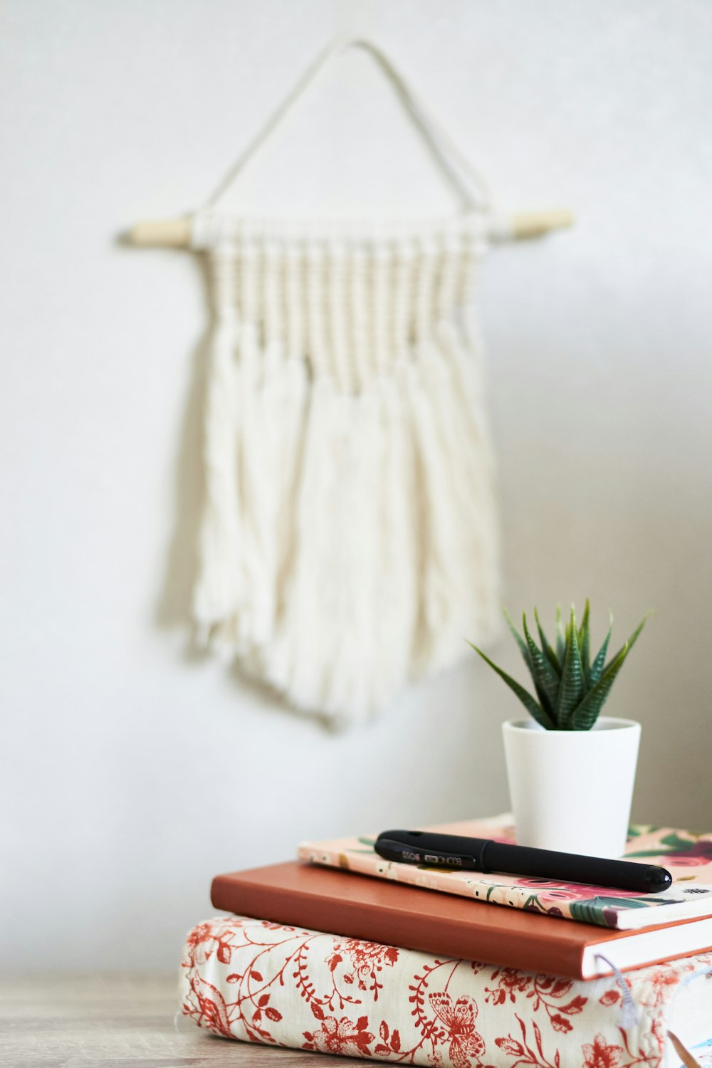 white textile on brown wooden table