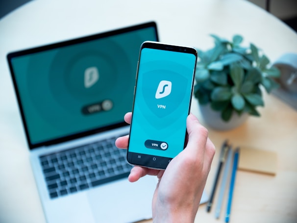 A person using a VPN app on their smartphone while connected to public Wi-Fi.