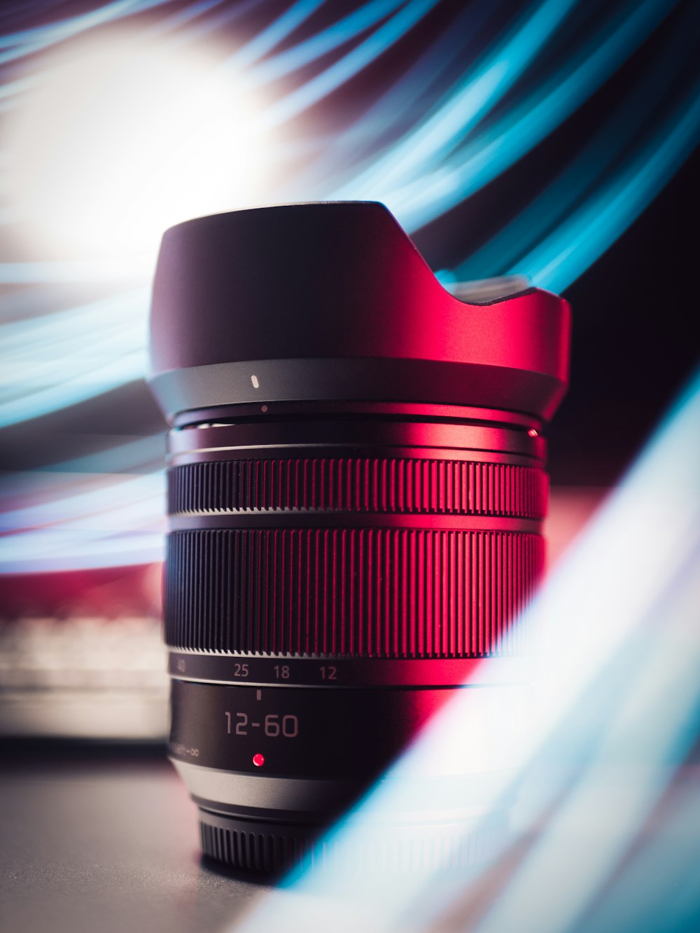 black camera lens on red and white textile
