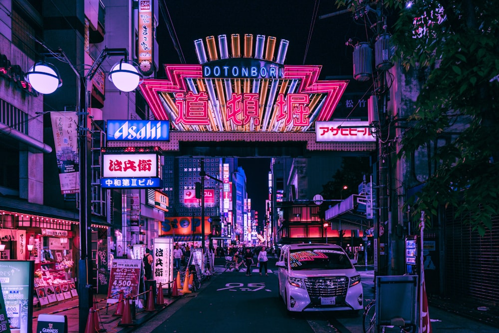 cars parked in front of store during night time