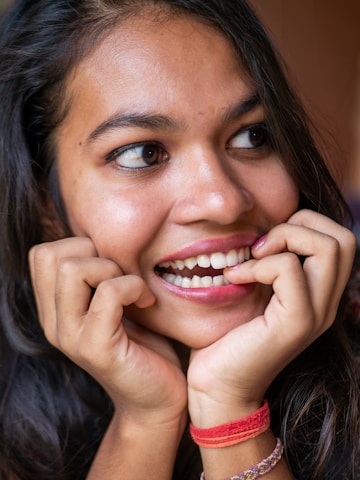 Close-up of a streamer smiling while engaging with their audience on Twitch.