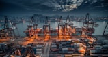 red and black cargo ship on dock during daytime