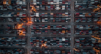 An aerial view of a bustling industrial complex with shipping containers.