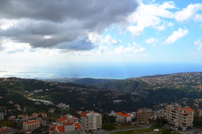 A panoramic view of a coastal city skyline highlighting various roofing and waterproofing projects.