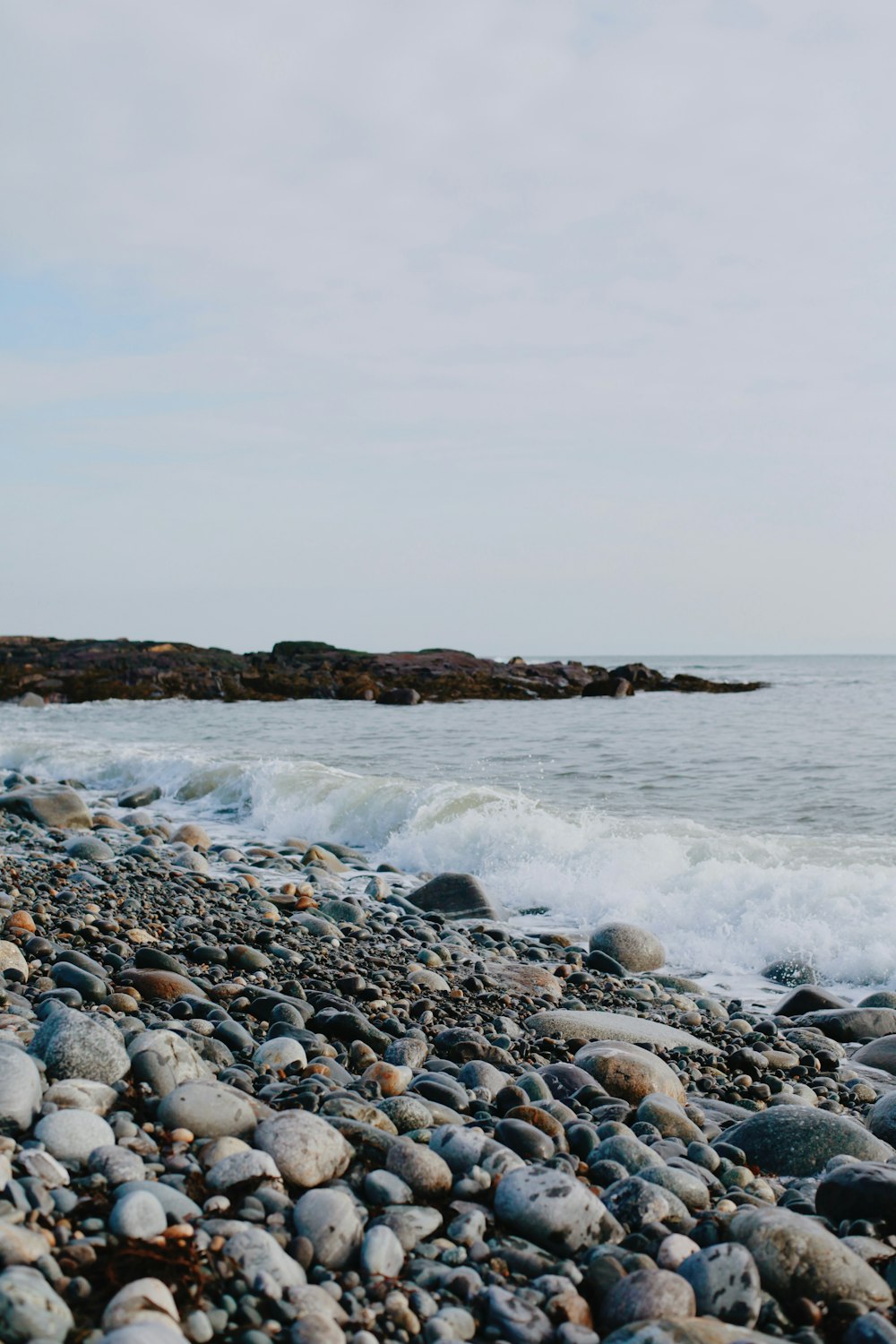 rocky shore with rocky shore during daytime