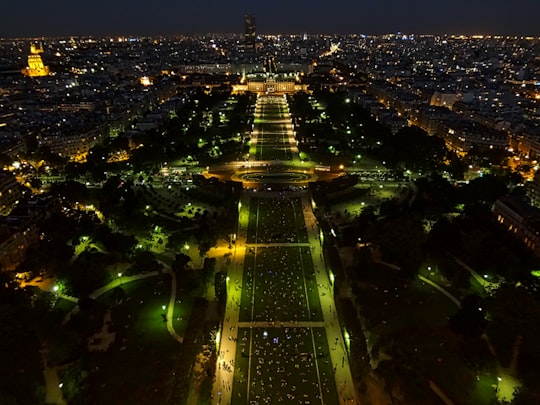 high rise buildings during night time in Eiffel Tower France