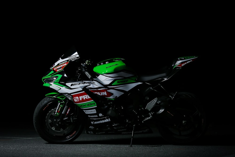 green and black honda sports bike