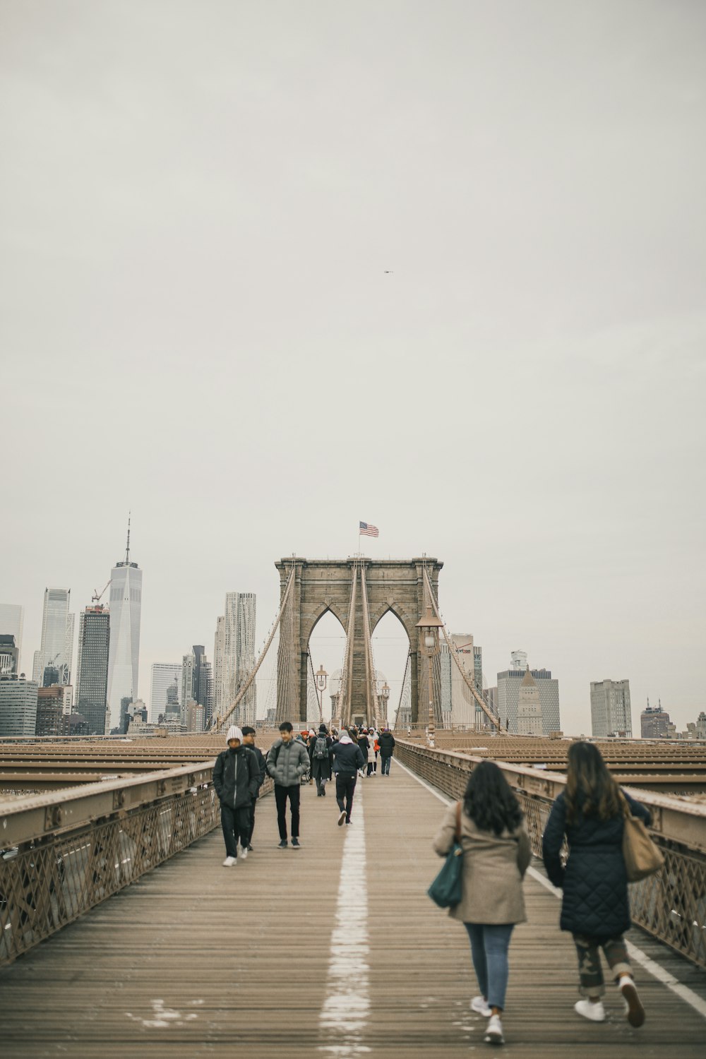 people walking on bridge during daytime